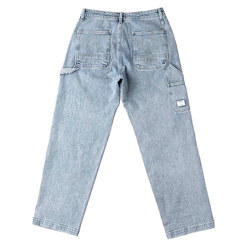 A pair of men's utility jeans featuring side pockets, double-knee construction, and a relaxed fit for comfort and durability.