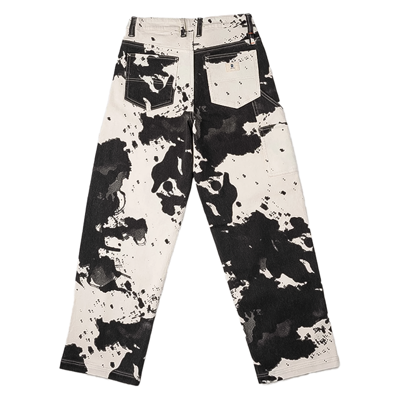 Women's black and white cow print pants, combining stylish design with performance features for climbing and hiking.