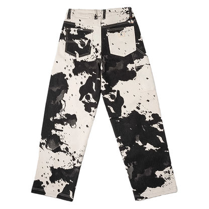 Women's black and white cow print pants, combining stylish design with performance features for climbing and hiking.