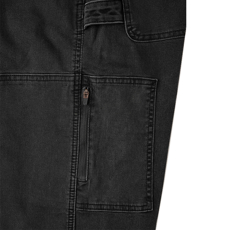 Detailed view of the zipped pocket of black utility jeans for comfort and active use.