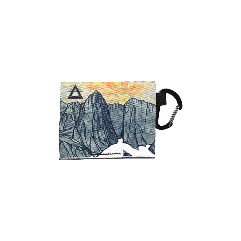 A compact wallet featuring a mountain illustration, ideal for adventurers wanting a lightweight, secure way to carry essentials.