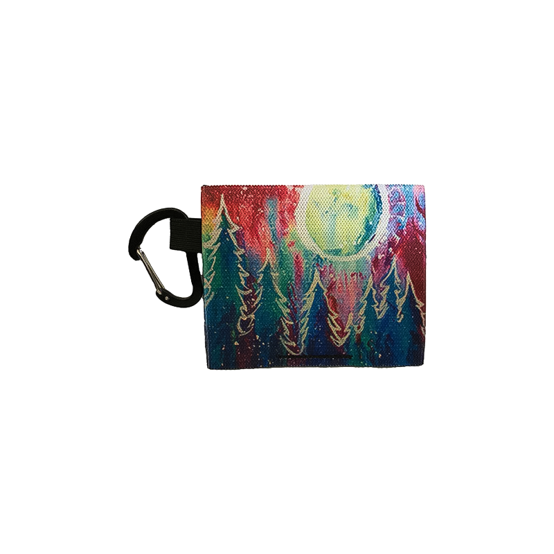 An artistic purse with a tree and moon design, combining functionality and vibrant aesthetics.