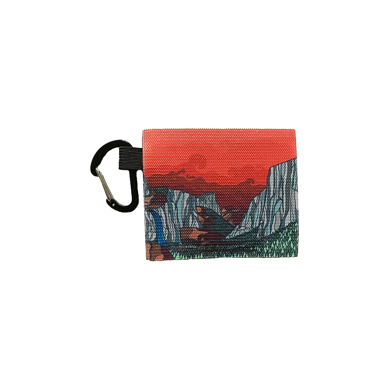 A red and orange pouch with a mountain scene, perfect for securely holding cards and cash while adventuring.