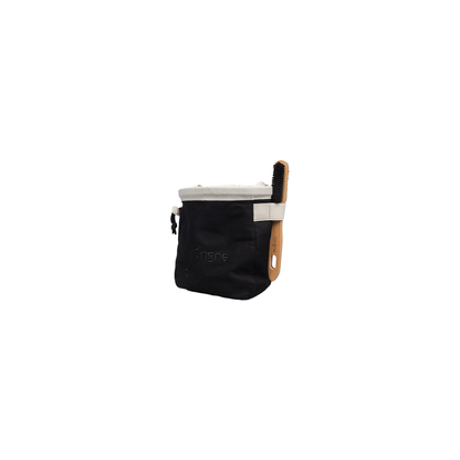 Black and white chalk bag with a wooden brush, designed for climbers, featuring a roomy opening and cinch closure.
