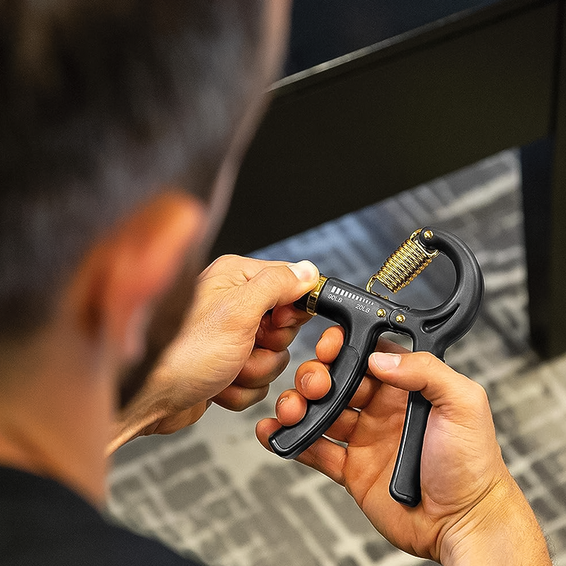 A man demonstrating how to use the SKLZ Grip Strength Trainer.