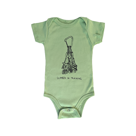 Green baby bodysuit in organic cotton featuring a climbing rack drawing and "Climber in Training" text, perfect for future climbers.