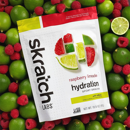 skratch labs raspberry limeade hydration sport drink mix bag with raspberries and limes for background 