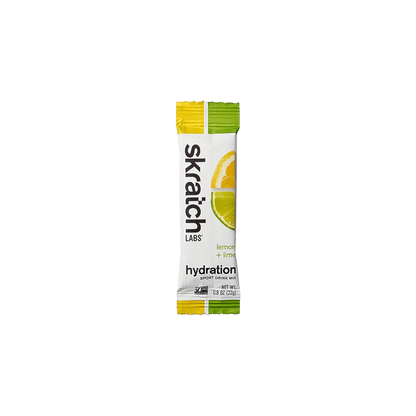 single serving Skratch Labs lemon and lime hydration sport drink mix packet on a white background