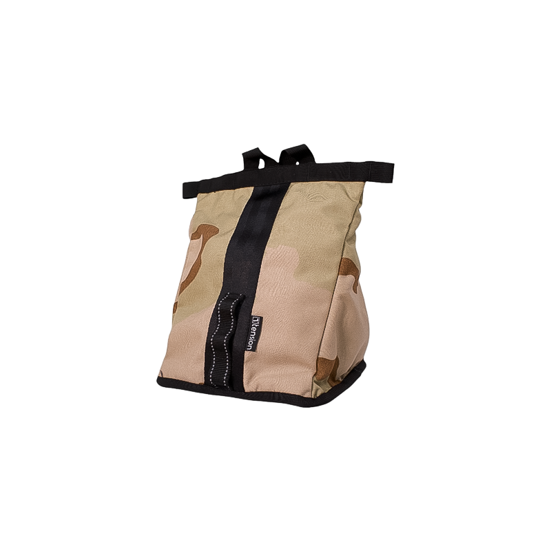 Camouflage chalk bucket for climbers, made of rugged fabric with a magnetic closure and plush lining.