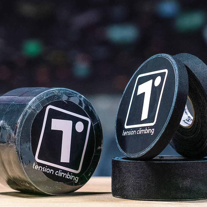 Three rolls of Tension Climbing tape in black, varying sizes of 0.3", 0.5", and 1", ideal for climbing in any conditions.