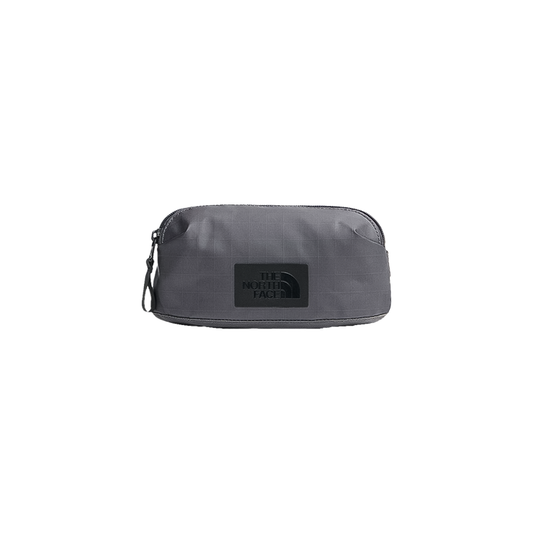 Grey North Face wash bag, compact and water-resistant, ideal for travel essentials with modular attachment system.