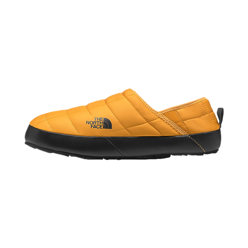 Gold North Face men's Thermoball slip-on shoes, featuring a water-resistant upper and cozy fleece lining for comfort and warmth.