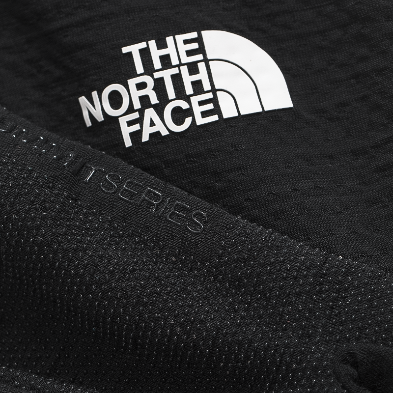 The North Face logo on the gloves, highlighting outdoor performance.