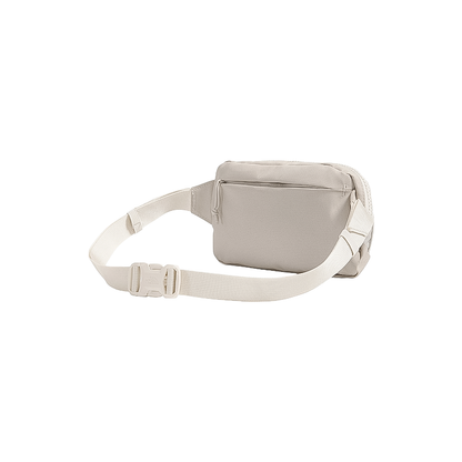 Beige 1L North Face waist bag for minimalist storage, featuring zippered pockets and an adjustable strap.
