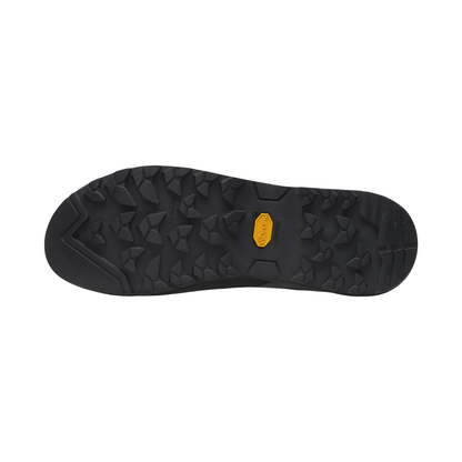 Close-up of the black sole of The North Face Verto Approach Shoe, featuring Vibram Megagrip outsole for climbing and hiking.