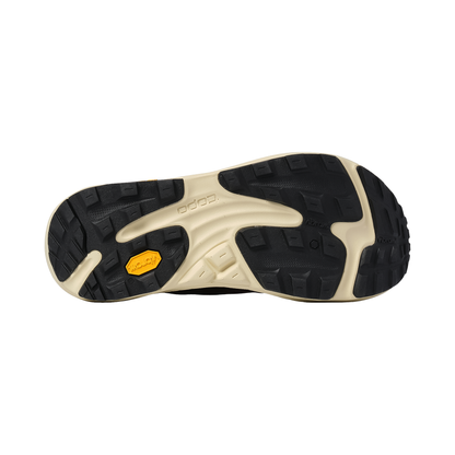 Detailed view of the black and yellow outsole of the maroon Topo Ultraventure 5, highlighting its grip and high-cushion features.