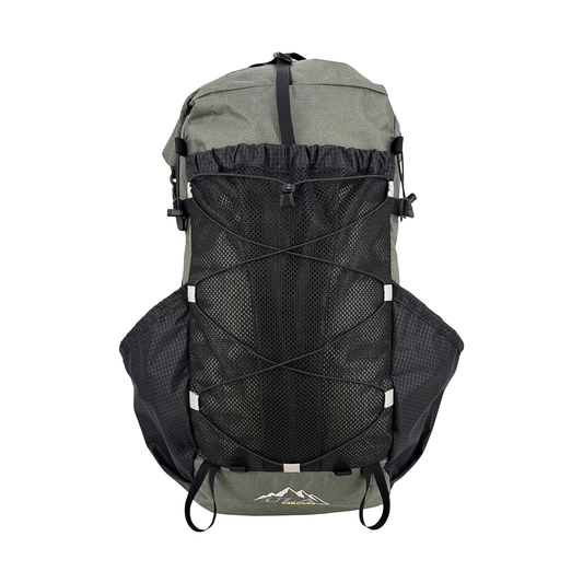 Large green and black ULA 25th Anniversary backpack with a mesh pocket, designed for comfort and high-capacity carry.