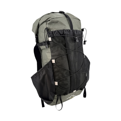 Green and black ULA 25th Anniversary backpack with a mesh pocket, built for support and extended trips in the backcountry.