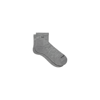 A pair of grey quarter socks made of Merino wool, displayed on a white background, showcasing their cushioned design.