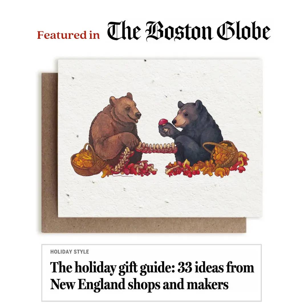 A newspaper article about a card depicting two bears eating mushrooms