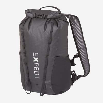 An all black roll top, waterproof backpack from Exped, on a white background.
