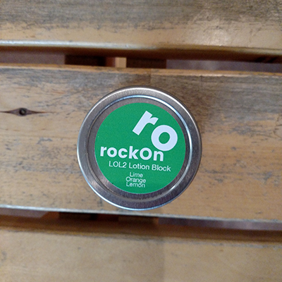 Green rockOn LOL2 Lotion Block With wood background