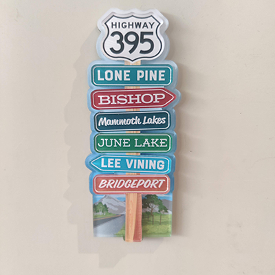 Road sign magnet with hwy 395, Lone Pine, Bishop, Mamoth Lakes, June Lake, Lee Vining, and Bridgeport - Vertical